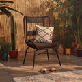 Woven Wing Chair with a Cane Back in Black Stained Rattan